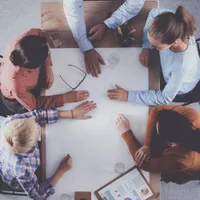 Business team in a meeting around a table with documents